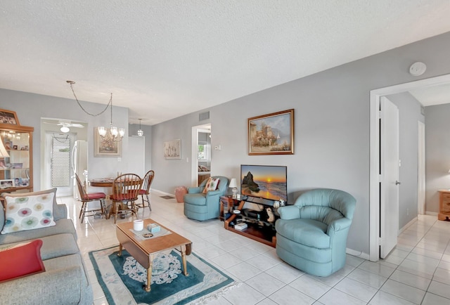 tiled living room with a textured ceiling