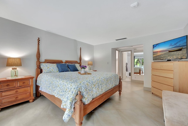 bedroom with light tile patterned floors