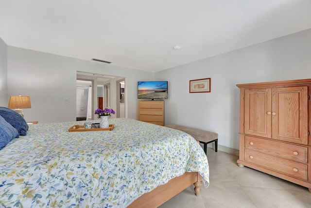 bedroom featuring light tile patterned floors