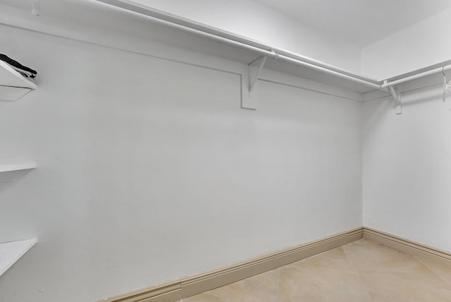 spacious closet with tile patterned flooring