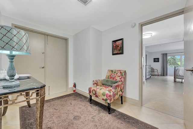 living area featuring tile patterned floors