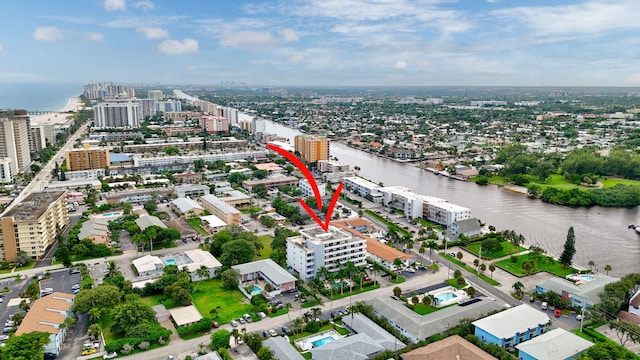 birds eye view of property featuring a water view