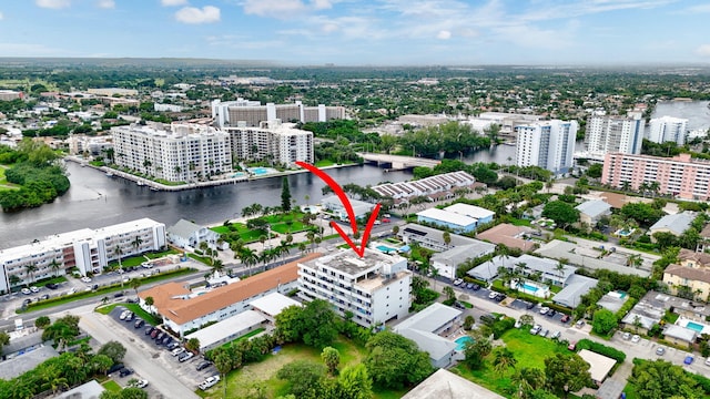 birds eye view of property with a water view