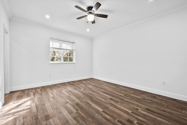 spare room with dark wood-type flooring, ornamental molding, and ceiling fan