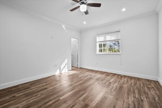 spare room featuring ceiling fan, ornamental molding, and wood-type flooring