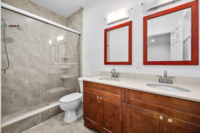 bathroom featuring vanity, tile patterned flooring, toilet, and walk in shower