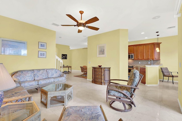 living room with sink and ceiling fan