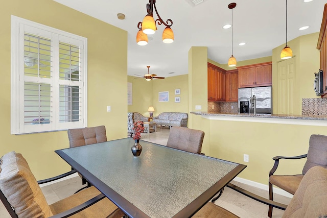 dining room with ceiling fan