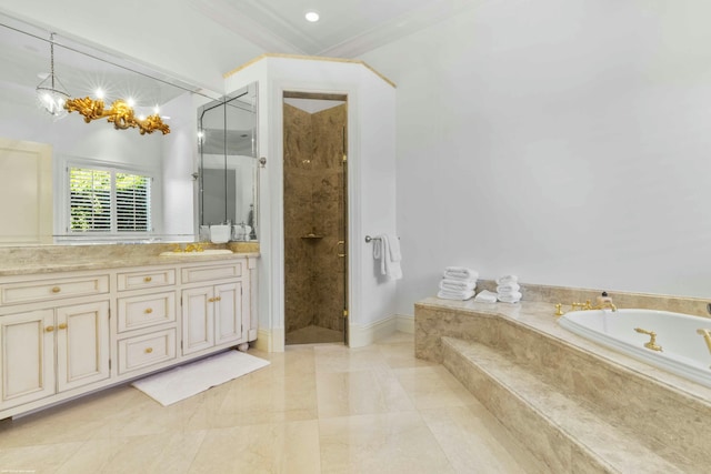 bathroom with plus walk in shower, ornamental molding, vanity, and an inviting chandelier