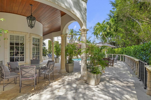 view of patio with a fenced in pool