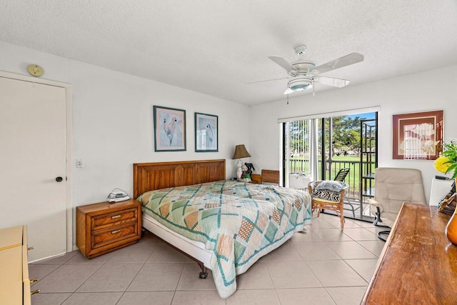 bedroom featuring access to exterior, ceiling fan, a textured ceiling, and light tile patterned flooring