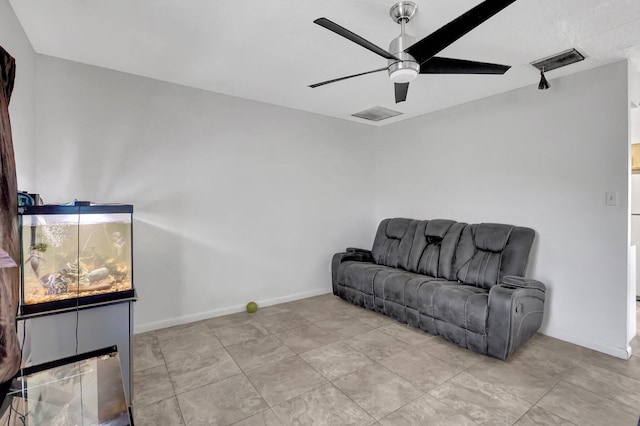 sitting room featuring ceiling fan