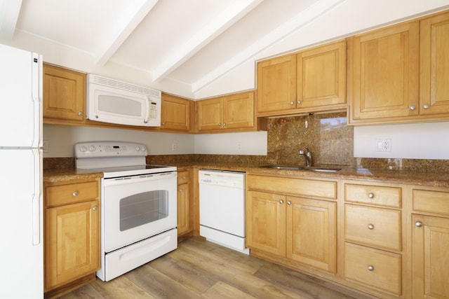 kitchen featuring vaulted ceiling with beams, light wood-style flooring, white appliances, a sink, and decorative backsplash