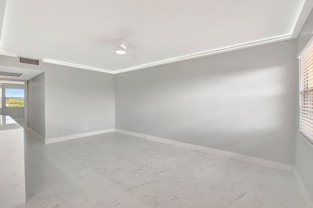 unfurnished room featuring ceiling fan