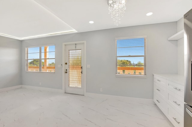 interior space featuring an inviting chandelier