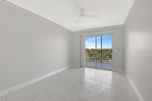 spare room with a ceiling fan, baseboards, and marble finish floor