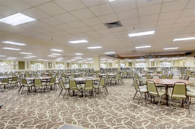 dining room featuring a paneled ceiling, visible vents, and a wealth of natural light