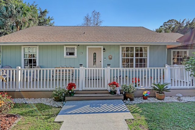 ranch-style house with covered porch