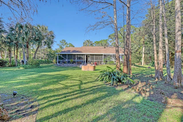 view of yard featuring a sunroom