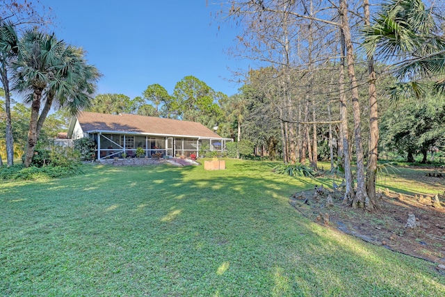 view of yard with a sunroom