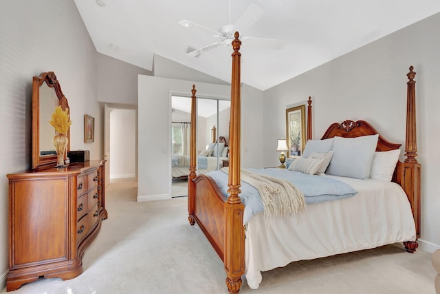 carpeted bedroom with vaulted ceiling and ceiling fan