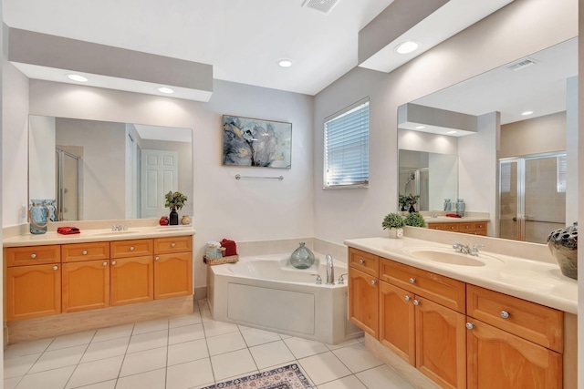 bathroom with vanity, shower with separate bathtub, and tile patterned flooring