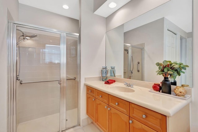 bathroom with vanity, tile patterned floors, and walk in shower