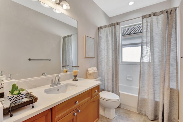 full bathroom featuring tile patterned floors, toilet, shower / bath combo with shower curtain, and vanity