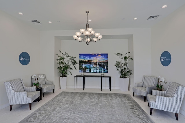 living area with carpet flooring and a notable chandelier