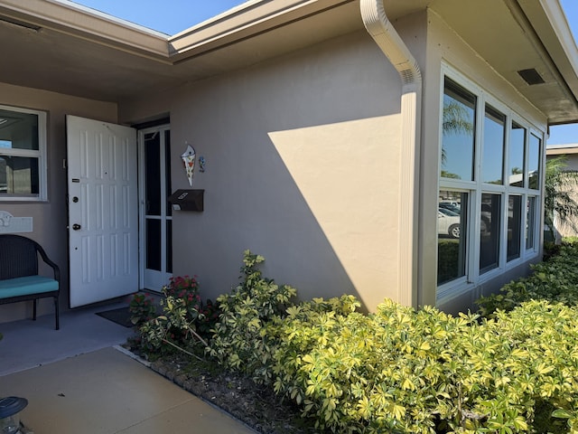 1292 High Point Pl S Unit B, Delray Beach, FL 33445 - doorway to property with stucco siding