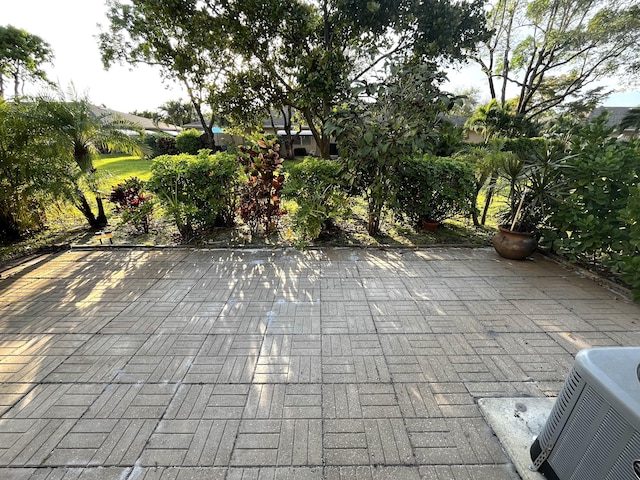 1292 High Point Pl S Unit B, Delray Beach, FL 33445 - view of patio featuring central AC unit