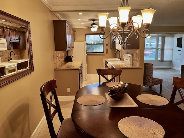 1292 High Point Pl S Unit B, Delray Beach, FL 33445 - dining area with ornamental molding, baseboards, a chandelier, plenty of natural light, and recessed lighting