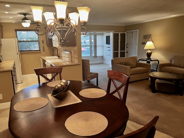 1292 High Point Pl S Unit B, Delray Beach, FL 33445 - dining space with baseboards, light colored carpet, ornamental molding, a chandelier, and a textured ceiling