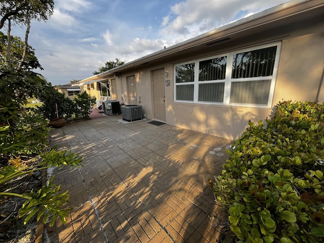 1292 High Point Pl S Unit B, Delray Beach, FL 33445 - deck featuring cooling unit and a patio