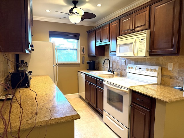 1292 High Point Pl S Unit B, Delray Beach, FL 33445 - kitchen featuring white appliances, a sink, ornamental molding, decorative backsplash, and a ceiling fan