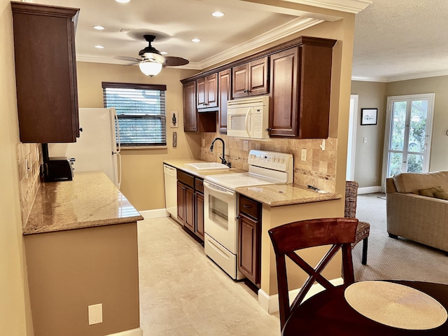 1292 High Point Pl S Unit B, Delray Beach, FL 33445 - kitchen featuring white appliances, ceiling fan, tasteful backsplash, crown molding, and recessed lighting