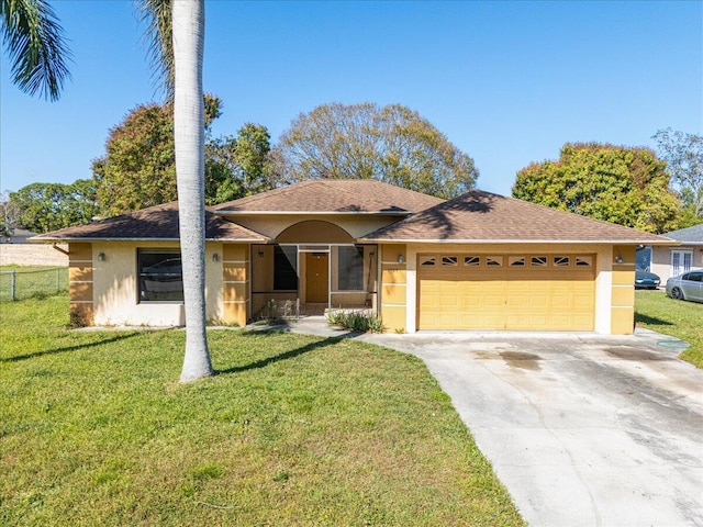 view of front of home featuring a garage and a front lawn