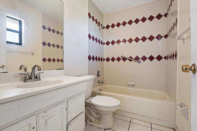 full bathroom with tiled shower / bath combo, vanity, a textured ceiling, tile patterned floors, and toilet