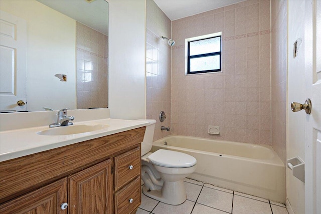 full bathroom with tiled shower / bath, tile patterned floors, toilet, and vanity