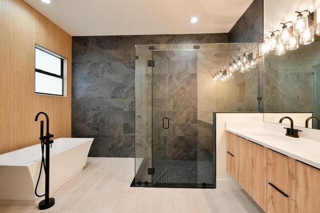 18202 Bridle Way, Fort Pierce, FL 34987 - bathroom featuring a freestanding bath, vanity, a shower stall, and recessed lighting