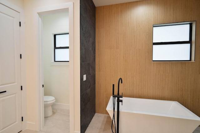 18202 Bridle Way, Fort Pierce, FL 34987 - bathroom featuring toilet and a soaking tub