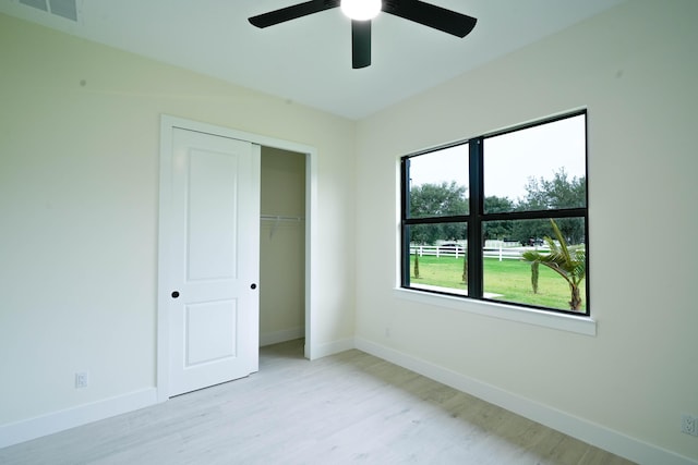 18202 Bridle Way, Fort Pierce, FL 34987 - unfurnished bedroom with light wood-style flooring, a closet, and ceiling fan