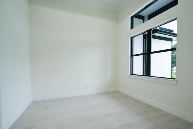 18202 Bridle Way, Fort Pierce, FL 34987 - empty room with wood finished floors and crown molding