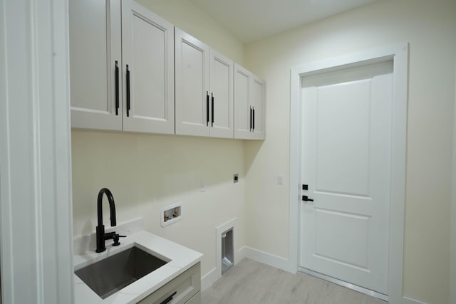 18202 Bridle Way, Fort Pierce, FL 34987 - laundry area featuring electric dryer hookup, cabinet space, and hookup for a washing machine