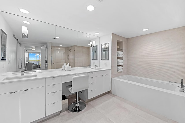 bathroom featuring vanity, tile patterned floors, and plus walk in shower