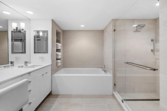 bathroom featuring vanity, tile patterned floors, and separate shower and tub