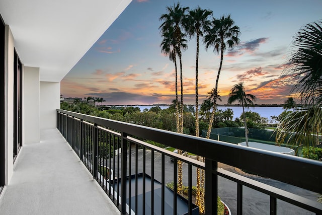 balcony at dusk with a water view