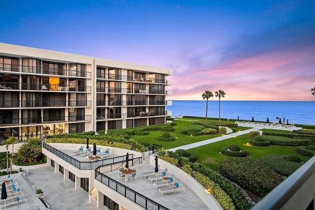 outdoor building at dusk featuring a water view