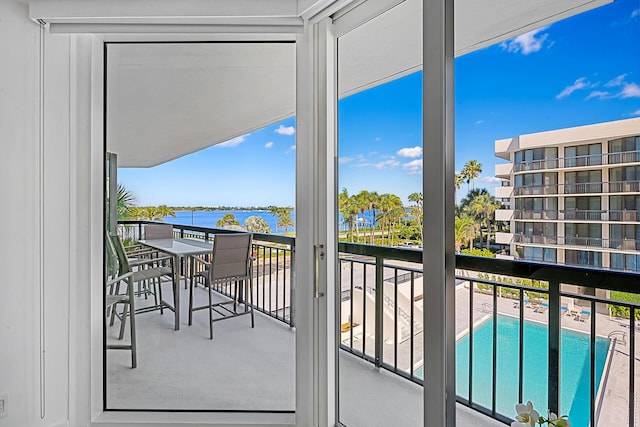 balcony featuring a water view