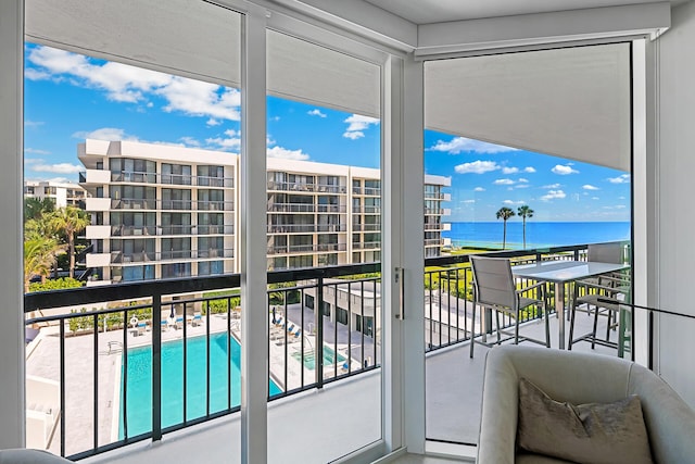 balcony featuring a water view